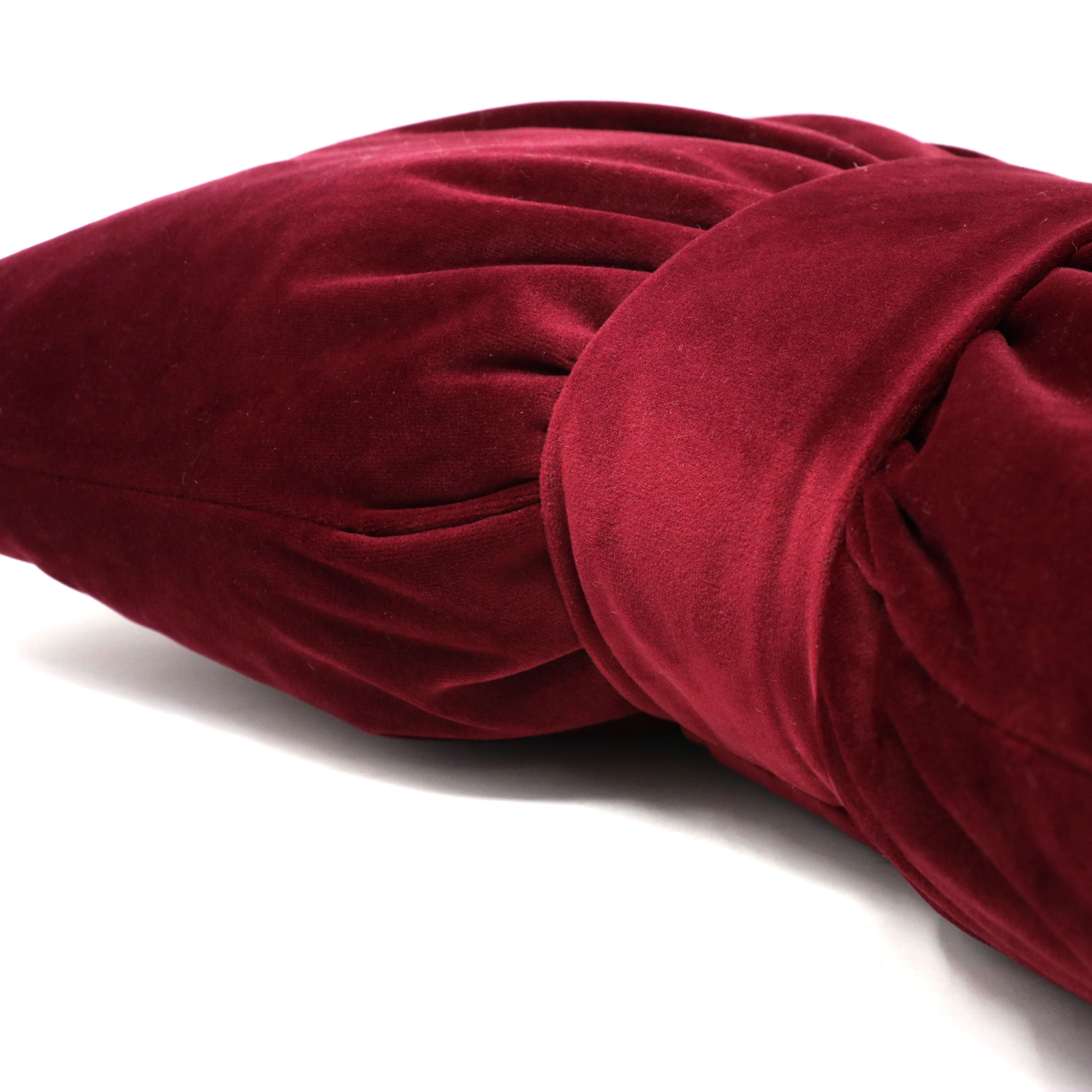 Bow cushion in Bordeaux velvet