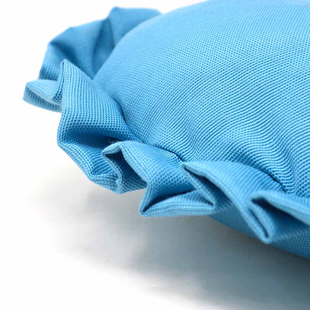 Heart cushion with light blue ruffles